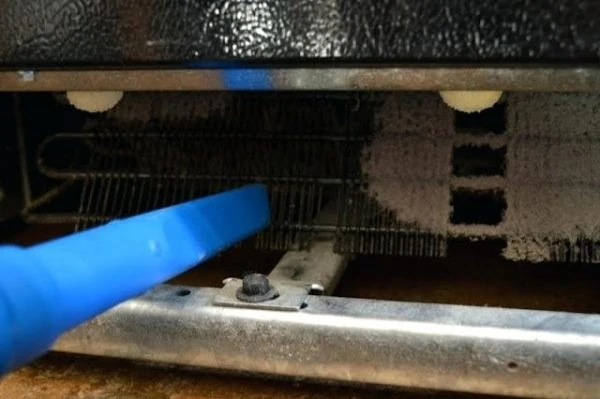 Cleaning the Condenser Coils (Whirlpool Refrigerator Not Cooling)